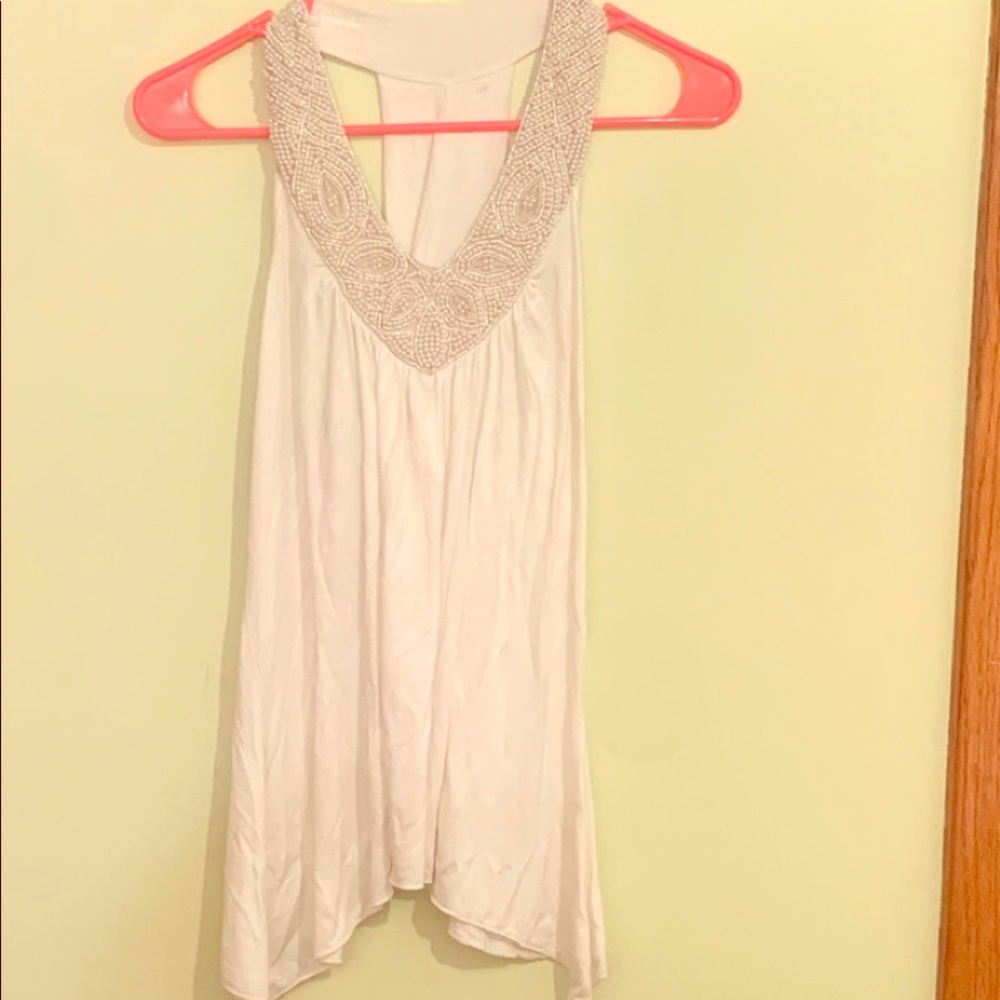 White flowy top with beaded neckline